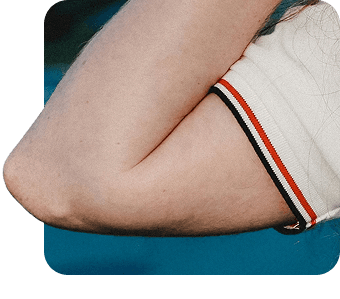 Close-up of a bent elbow in a white shirt
