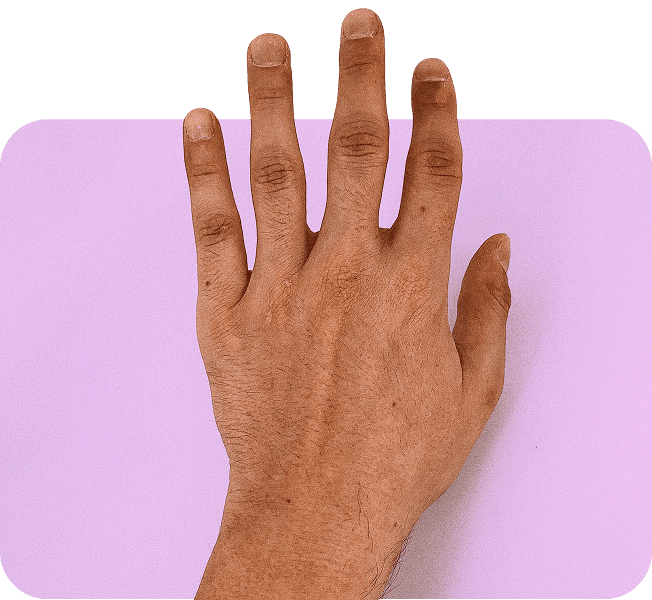 Close-up of a hand against a soft purple background